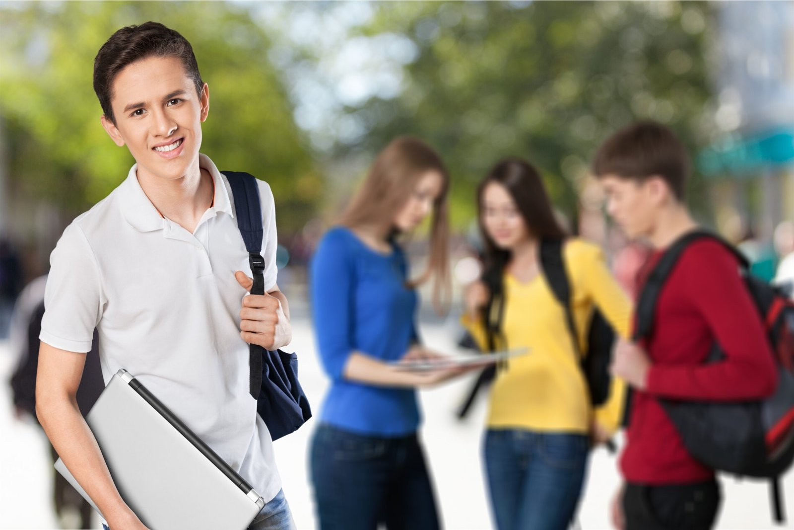 STUDY IN NEW ZEALAND happy young student with laptop 1 scaled